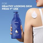 NIVEA Body Milk, Moisturizer Lotion, with Deep Moisture Serum, Almond Oil & Vitamin E (400 ml) - Image 2